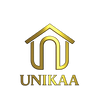 Gold UNIKAA logo with stylized house icon and uppercase serif text on a transparent background