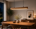 UNIKAA modern linear wood pendant light for dining room installed above dining table in a warm modern interior