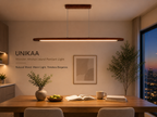 UNIKAA modern linear wood pendant light for kitchen island with warm LED lighting above modern wooden dining table
