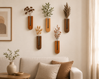 Unikaa wooden wall vase set displayed above a sofa with dried flowers for Scandinavian-inspired home wall decoration.